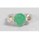 A LOVELY PEAR SHAPED EMERALD AND DIAMOND RING set in 18ct white gold.