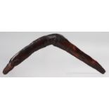 AN ABORIGINAL WOODEN BOOMERANG, CIRCA. 1880. 20ins long.