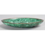 A MALACHITE OVAL DISH. 9ins long.