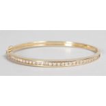 A 14CT YELLOW GOLD AND DIAMOND BRACELET.