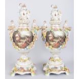 A GOOD PAIR OF "DRESDEN" STYLE FLOWER ENCRUSTED VASES, COVERS AND STANDS, painted with reverse