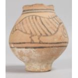 A SMALL INDUS VALLEY CIRCULAR POT painted with two birds. 3.5ins high.