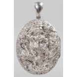 AN INDIAN SILVER OVAL LOCKET.