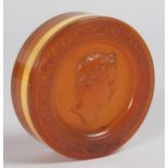 A REGENCY TORTOISESHELL CIRCULAR BOX AND COVER, the lid with a pressed portrait of Caesar. 3ins