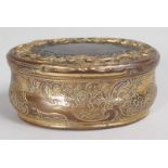 AN 18TH CENTURY CONTINENTAL GILT METAL AND TORTOISESHELL SNUFF BOX with scrolled and floral