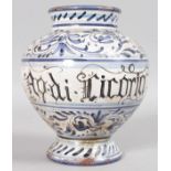 A MAJOLICA BLUE AND WHITE PAINTED DRUG JAR.