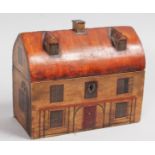 A GEORGIAN PAINTED WOOD HOUSE TEA CADDY with shaped domed top, painted door and windows. 9.5ins