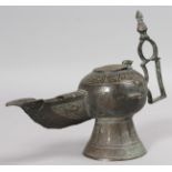 AN EARLY ISLAMIC BRONZE OIL LAMP. 8ins long.