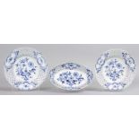 A PAIR OF MEISSEN CIRCULAR PIERCED BLUE AND WHITE ONION PATTERN PLATES, 8ins, and an OVAL DISH, 8.