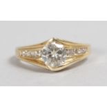 A GOOD 14CT YELLOW GOLD DIAMOND RING, central stone 1CT approx., with diamond shoulders.