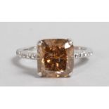 A SUPERB 18CT WHITE GOLD RING, set with LARGE PRINCESS CUT COGNAC DIAMOND of 5.15CTS.