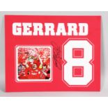 A STEVEN GERRARD CUP WINNERS SIGNED NO. 8 PHOTO.