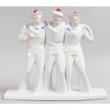 A GROUP OF THREE ART DECO DESIGN SAILOR BOYS. 11ins high.