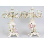 A PAIR OF "DRESDEN" STYLE SEVEN LIGHT CANDELABRA with flower encrusted arms, the bases with