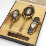 1172  A French gilt-bronze and hand-painted vanity set Late 19th/early 20th century, a four-piece