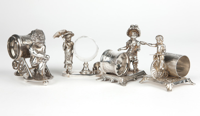 4 Victorian figural silver-plated napkin rings