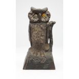 A painted cast-iron owl-form mechanical bank