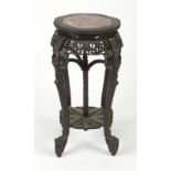 A Chinese export carved hardwood plant stand