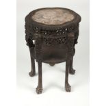 A Chinese export carved hardwood lamp table