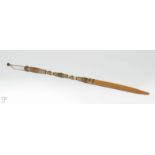 1060 Mehl Lawson TCA (1942-* Bonita, CA) A braided rawhide riding quirt with tanned leather