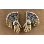 1253 A Pair of Woodland Indian beaded gauntlets Early 20th century, each trade cloth-lined hide