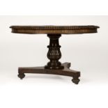 1016 An American rosewood pedestal table Mid-19th century, the circular gadrooned-edge table top