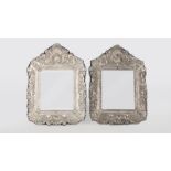 A pair of sterling silver repousse mirrors