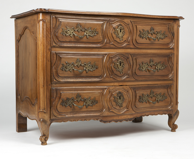 A Continental three-drawer bow-front commode