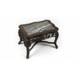 A Chinese export carved hardwood occasional table