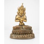 A Sino-Tibetan gilt-bronze figure of Vajrasattva