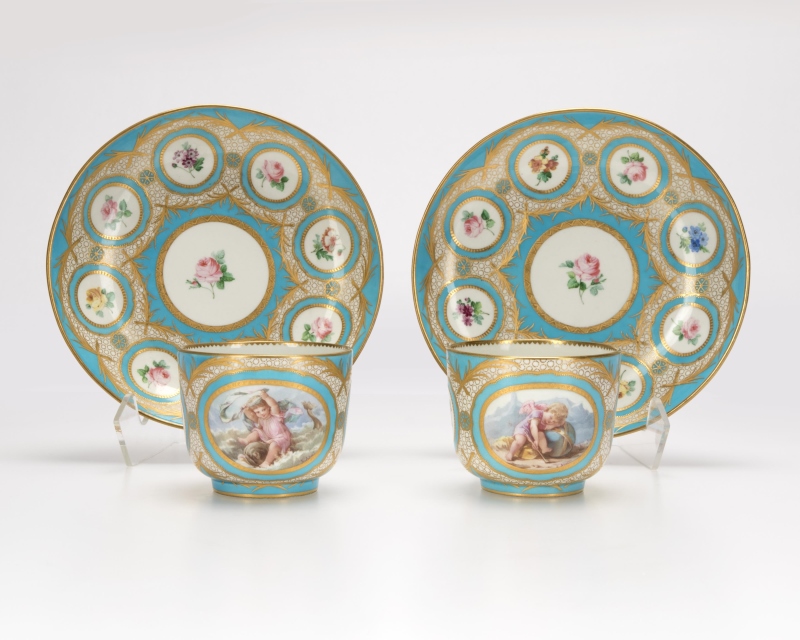 A pair of French porcelain teacups and saucers