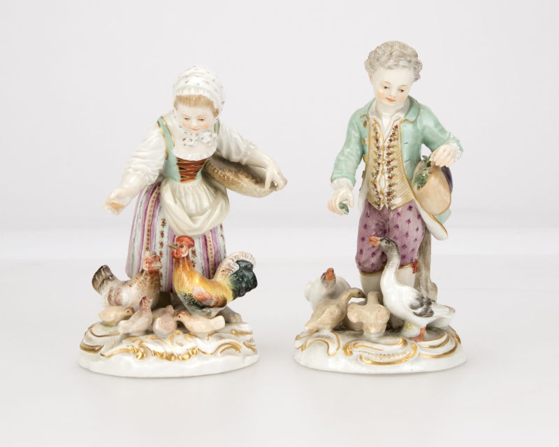A complimentary pair of Meissen porcelain figures
