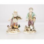 A complimentary pair of Meissen porcelain figures