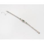 An Edwardian emerald and diamond bracelet