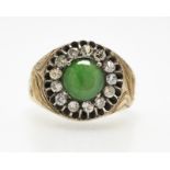 A jade cabochon, diamond and silver-topped ring