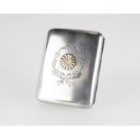A silver and gold Japanese crest cigarette case