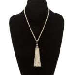 An Edwardian seed pearl & diamond tassel necklace