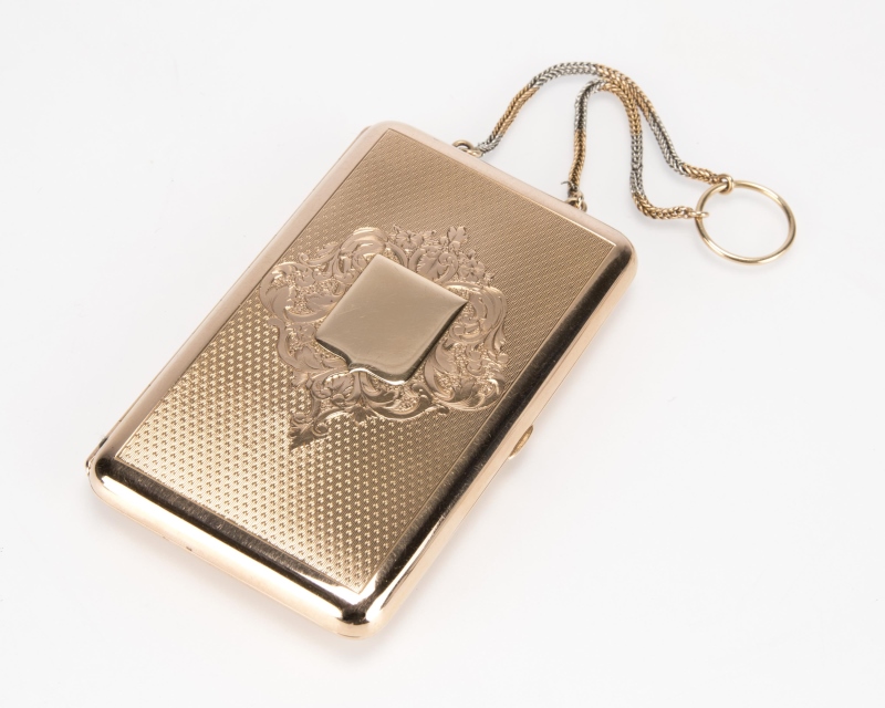 An antique gold dance card purse