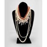 Ten various coral bead necklaces