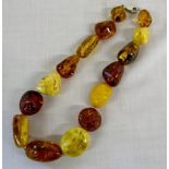 String of 15 various amber beads with si