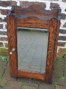 Small wall mounted cupboard with mirror