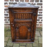 Ornately carved reproduction oak corner