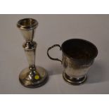 Silver candlestick and a silver cup