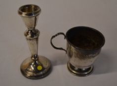 Silver candlestick and a silver cup