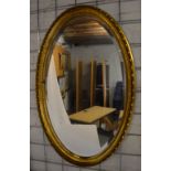 Oval gilt framed wall mirror