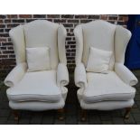 2 upholstered wing back armchairs