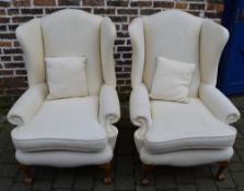 2 upholstered wing back armchairs