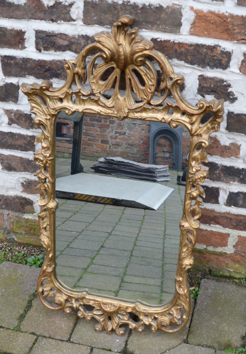 Ornate gilt framed wall mirror