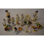 Various ceramic figures including a cont