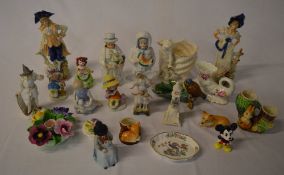 Various ceramic figures including a cont